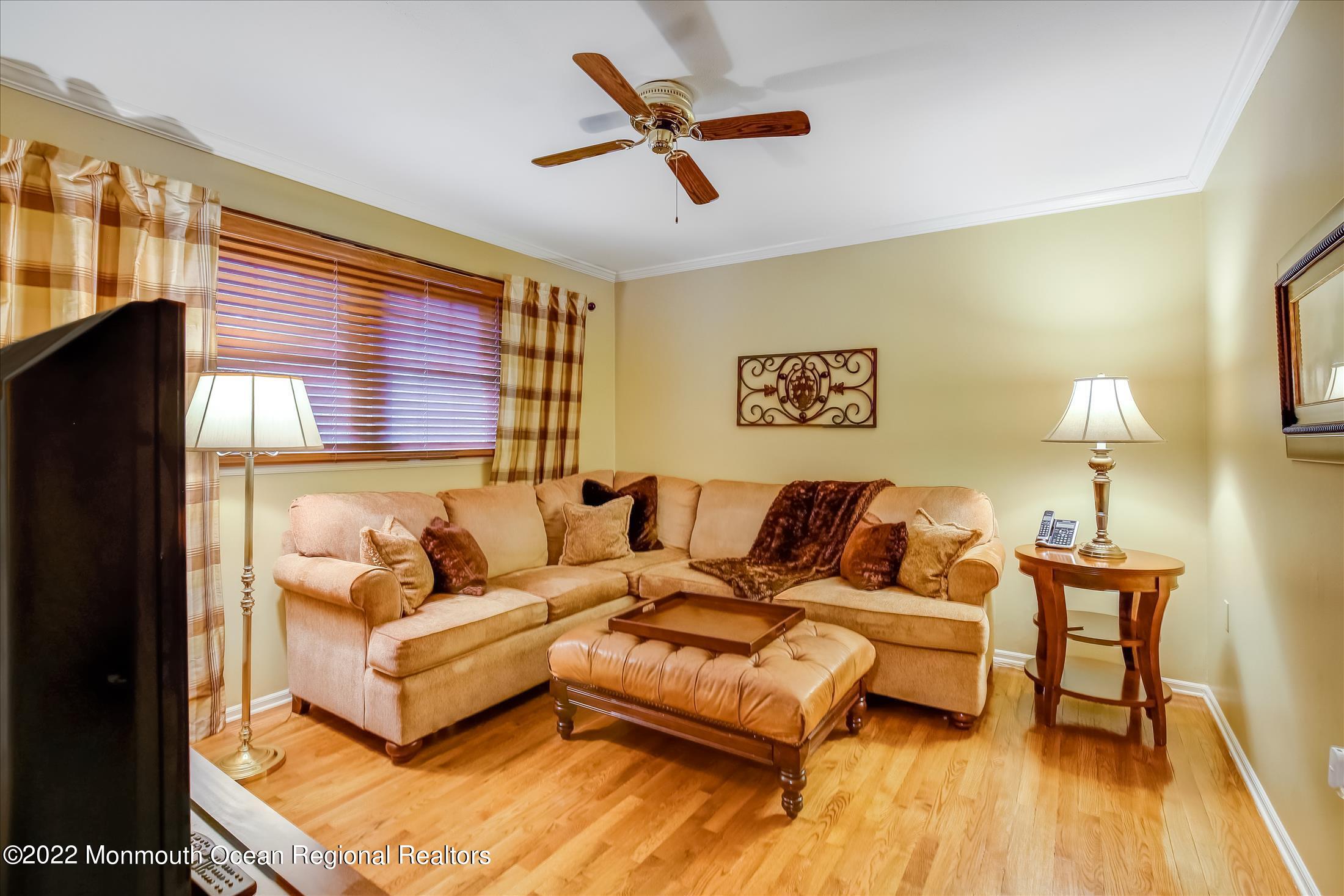 45 Ruby Drive Morganville, NJ 07751 - Photo 23 of 47 a living room with furniture and a large window