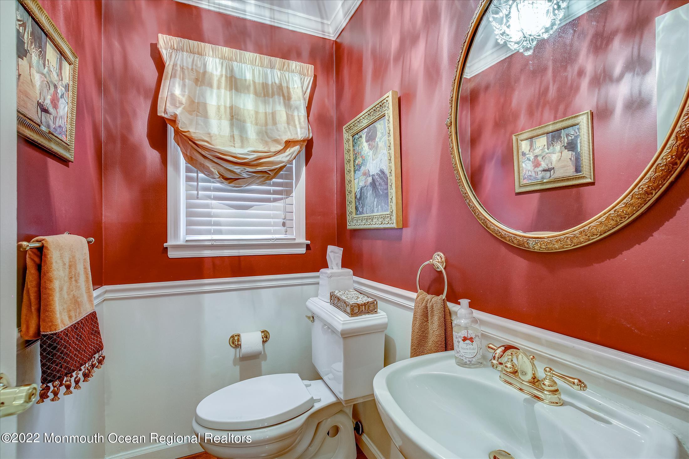 45 Ruby Drive Morganville, NJ 07751 - Photo 24 of 47 a bathroom with a sink and a mirror