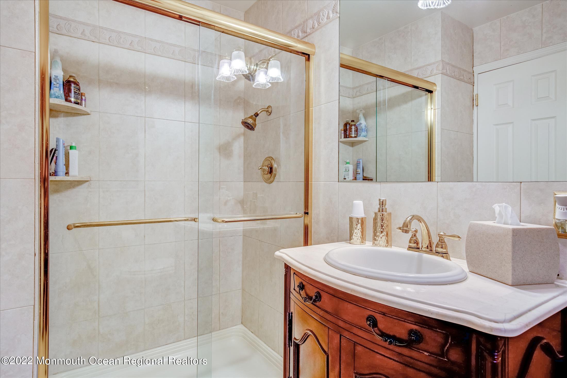45 Ruby Drive Morganville, NJ 07751 - Photo 29 of 47 a bathroom with a sink and a mirror
