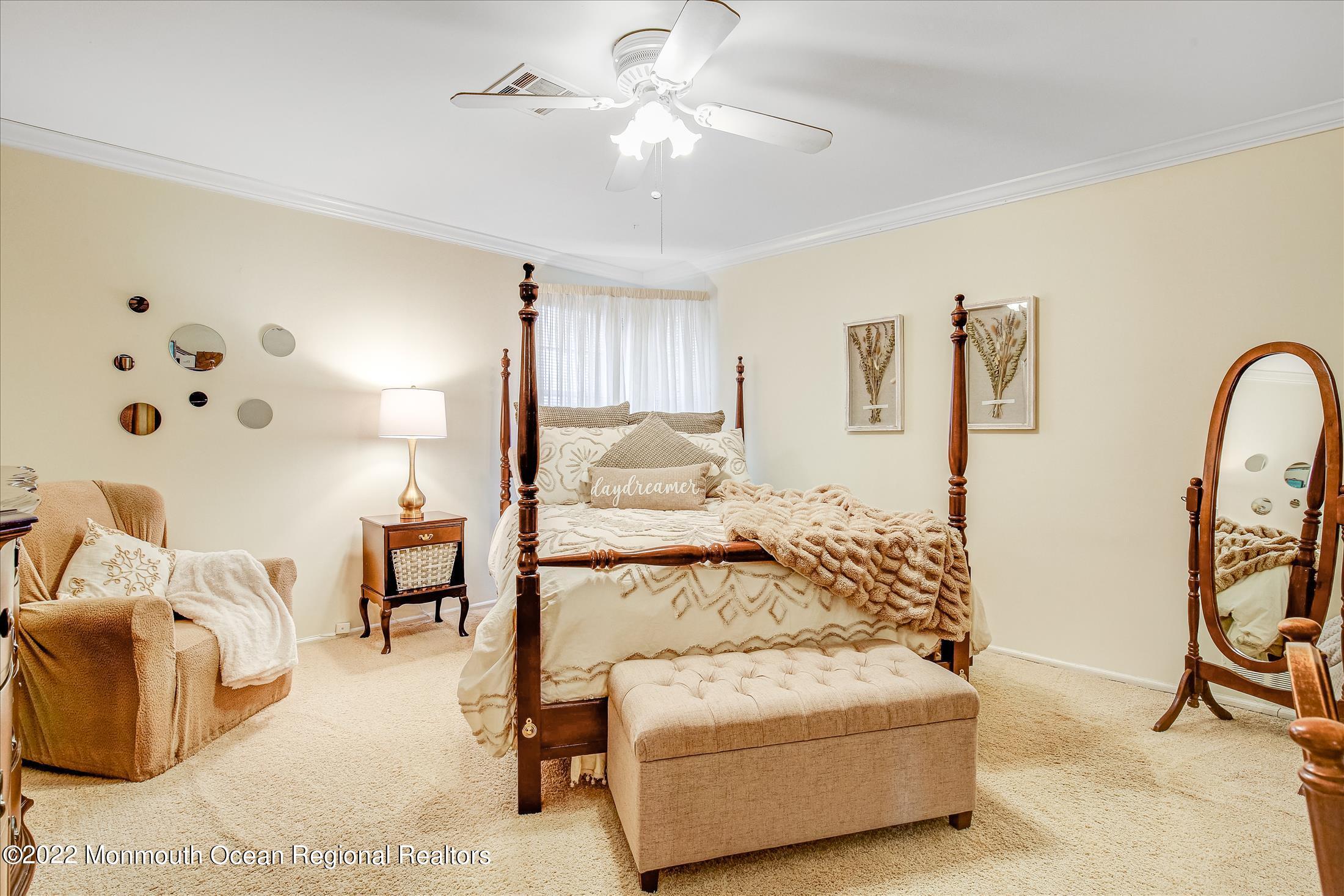 45 Ruby Drive Morganville, NJ 07751 - Photo 32 of 47 a bedroom with furniture and a large mirror