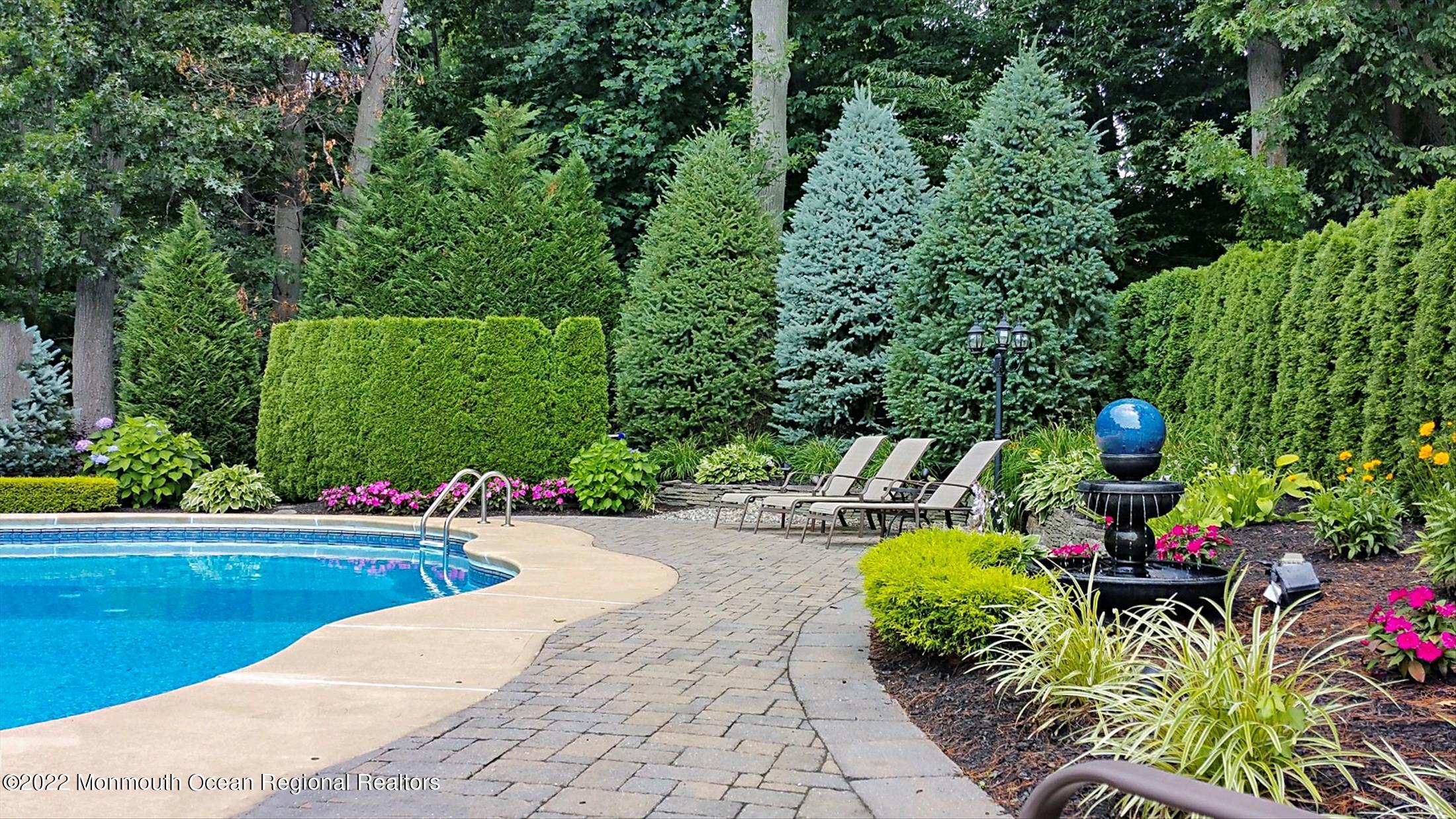 45 Ruby Drive Morganville, NJ 07751 - Photo 39 of 47 a view of a backyard with sitting area