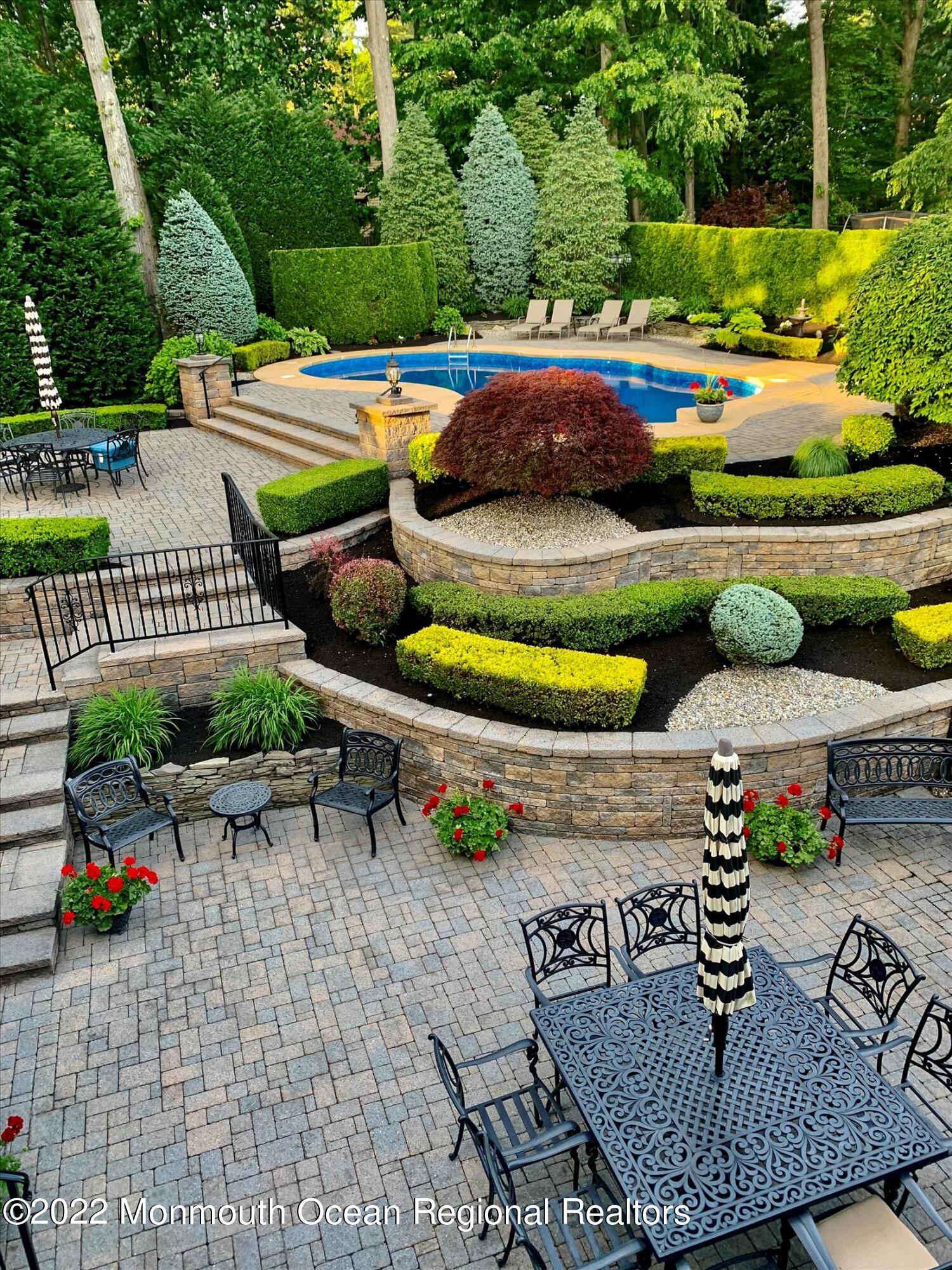 45 Ruby Drive Morganville, NJ 07751 - Photo 45 of 47 a view of outdoor space yard swimming pool and patio