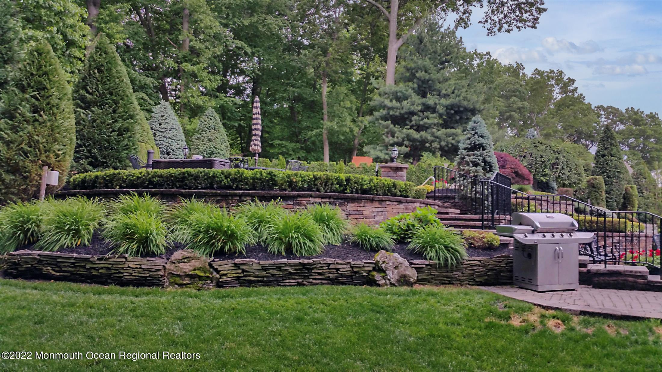 45 Ruby Drive Morganville, NJ 07751 - Photo 47 of 47 a view of a garden and swimming pool