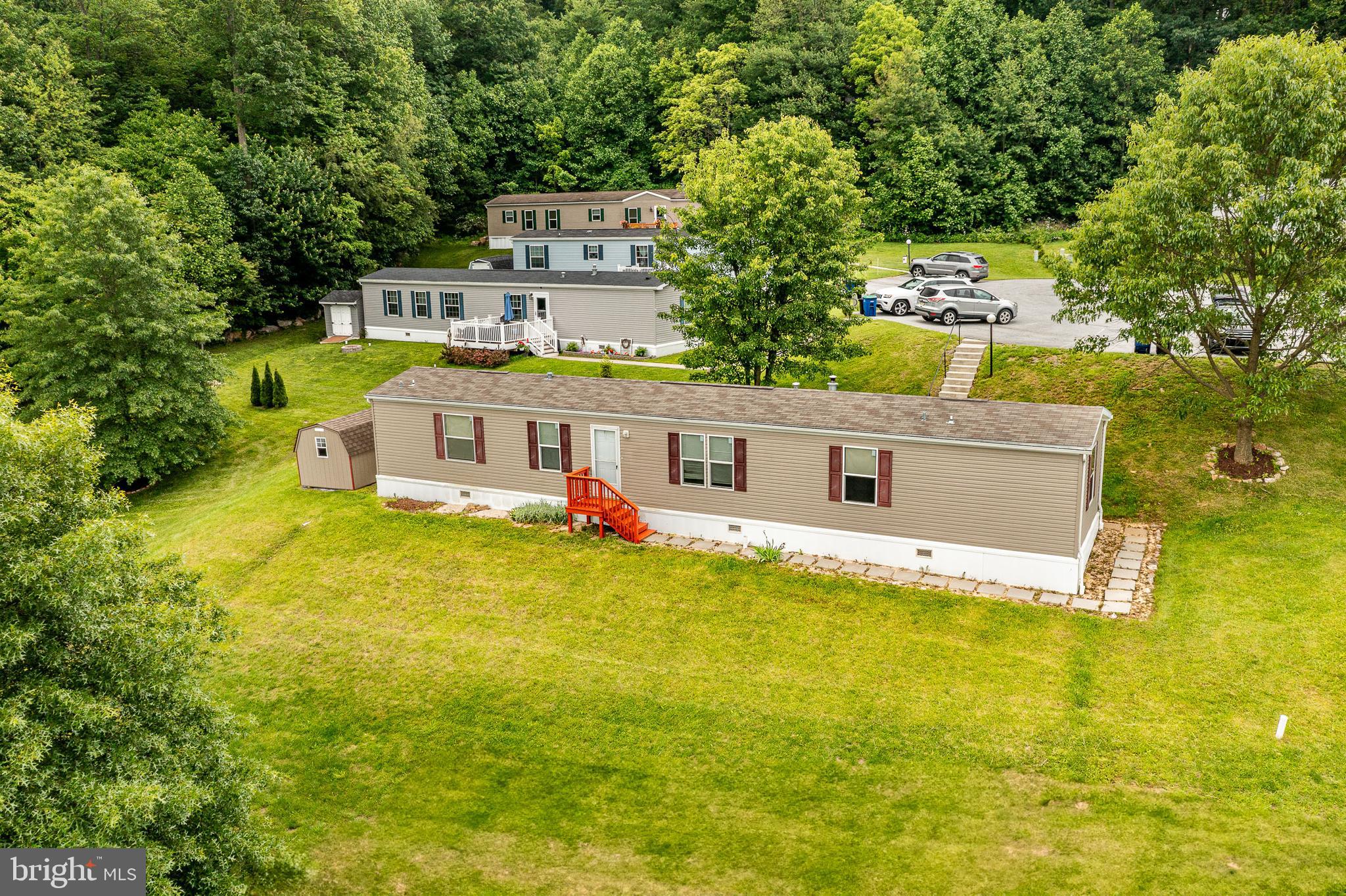 an aerial view of a house with swimming pool