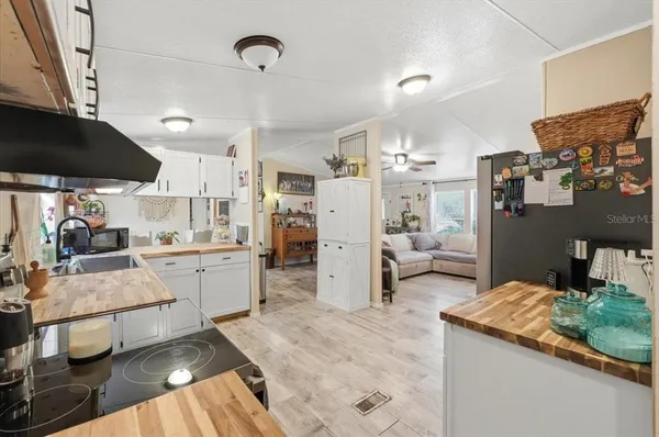 a kitchen with stainless steel appliances granite countertop a sink and cabinets