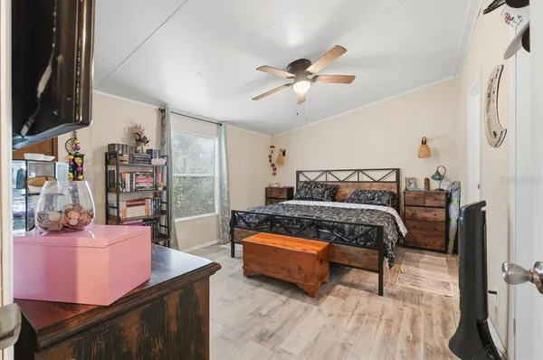 a bedroom with a bed and window