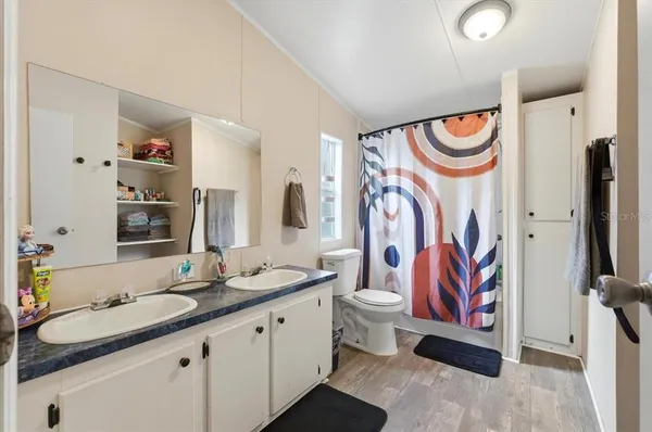 a en suite bathroom with a sink and a mirror