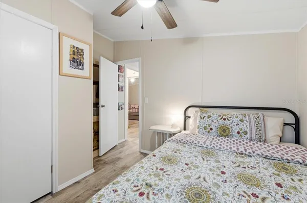 a bedroom with a bed and a view of bathroom