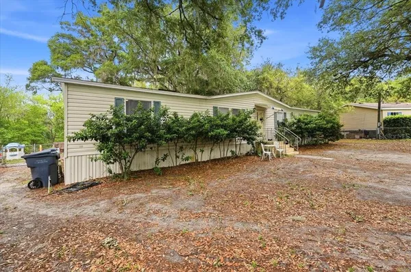 an aerial view of residential houses with outdoor and green space