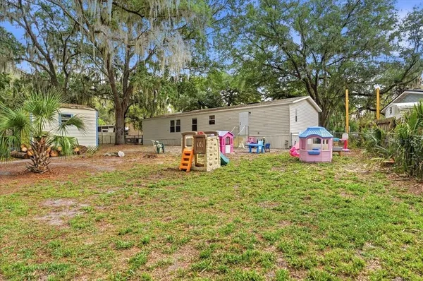 an aerial view of a house with a yard