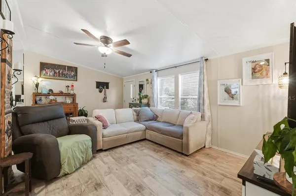a living room with furniture and a large window
