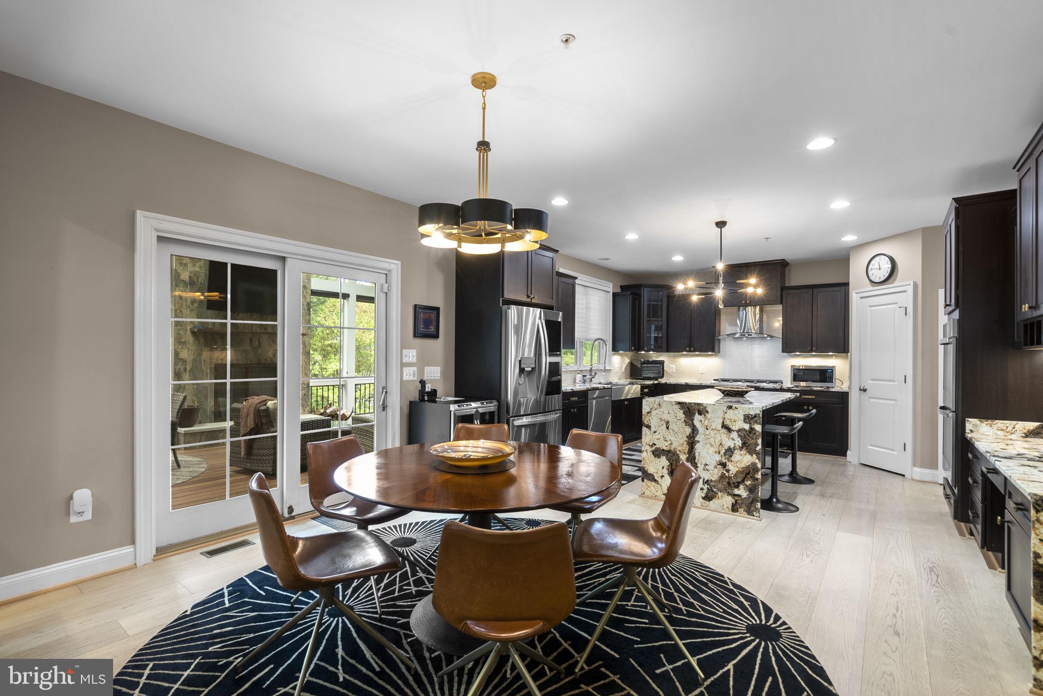 4702 Edgefield Road Bethesda, MD 20814 - Photo 11 of 58 Modern kitchen with stylish dining area.
