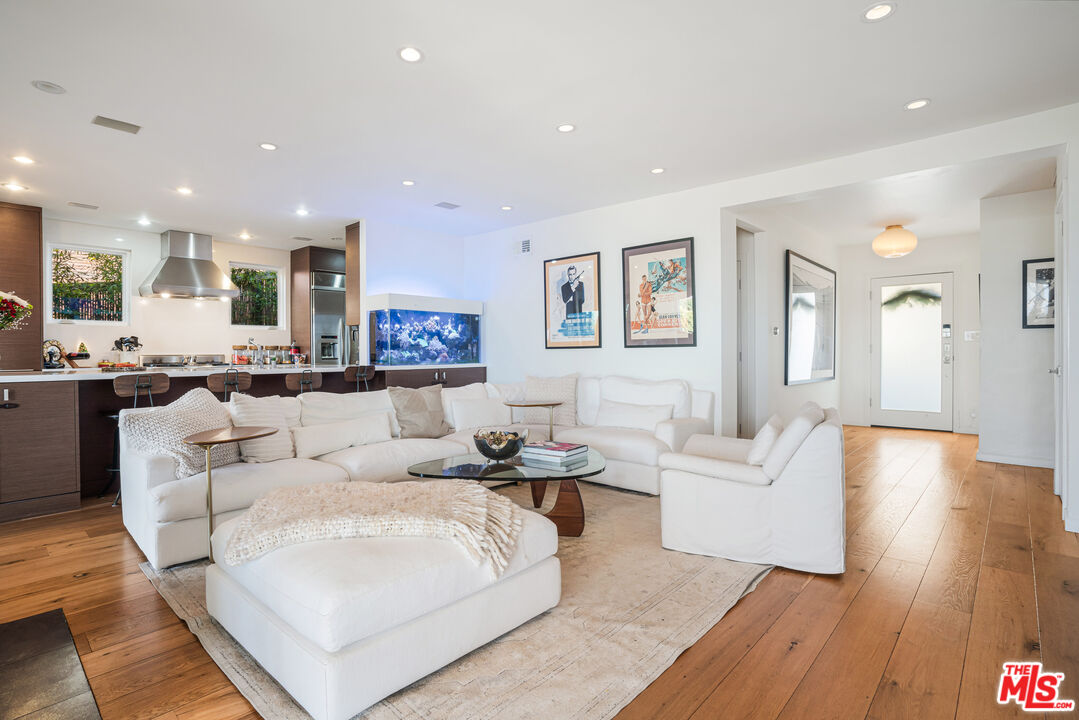 245 Tranquillo Road Pacific Palisades, CA 90272 - Photo 11 of 45 a living room with furniture and wooden floor