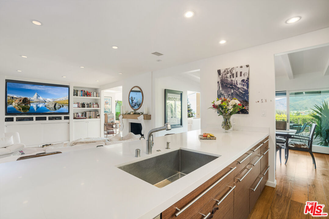 245 Tranquillo Road Pacific Palisades, CA 90272 - Photo 23 of 45 a view of a living room and dining room