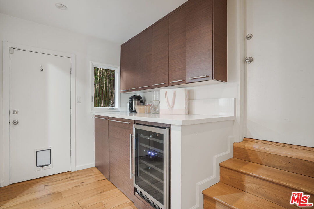 245 Tranquillo Road Pacific Palisades, CA 90272 - Photo 24 of 45 a kitchen with a refrigerator and a stove