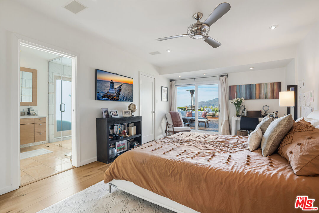 245 Tranquillo Road Pacific Palisades, CA 90272 - Photo 29 of 45 a bedroom with a bed and a view of kitchen