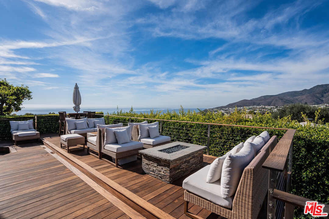 245 Tranquillo Road Pacific Palisades, CA 90272 - Photo 38 of 45 a view of a terrace with couches