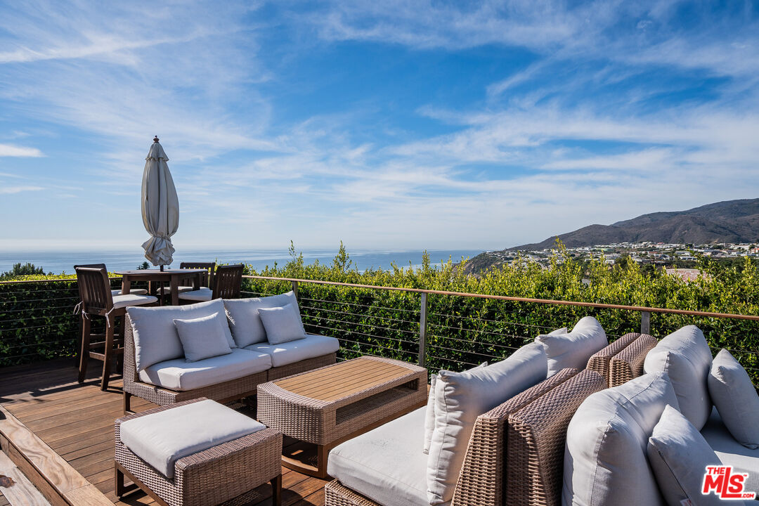 245 Tranquillo Road Pacific Palisades, CA 90272 - Photo 39 of 45 a view of roof deck with seating space and city view