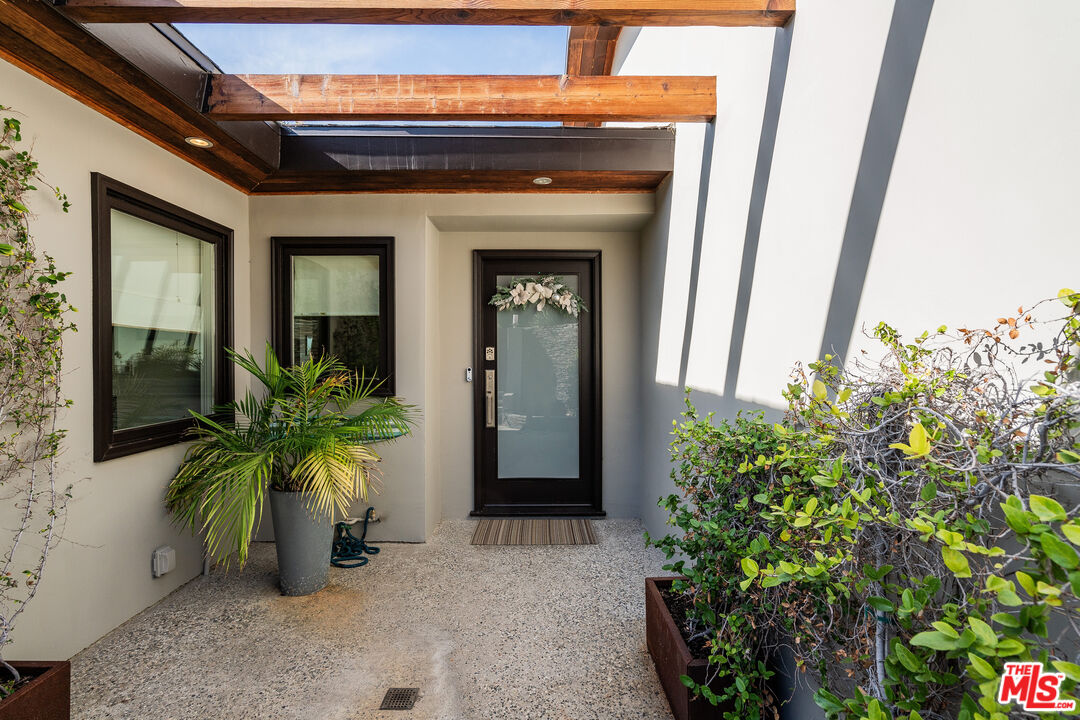 245 Tranquillo Road Pacific Palisades, CA 90272 - Photo 5 of 45 a view of a entryway door of the house