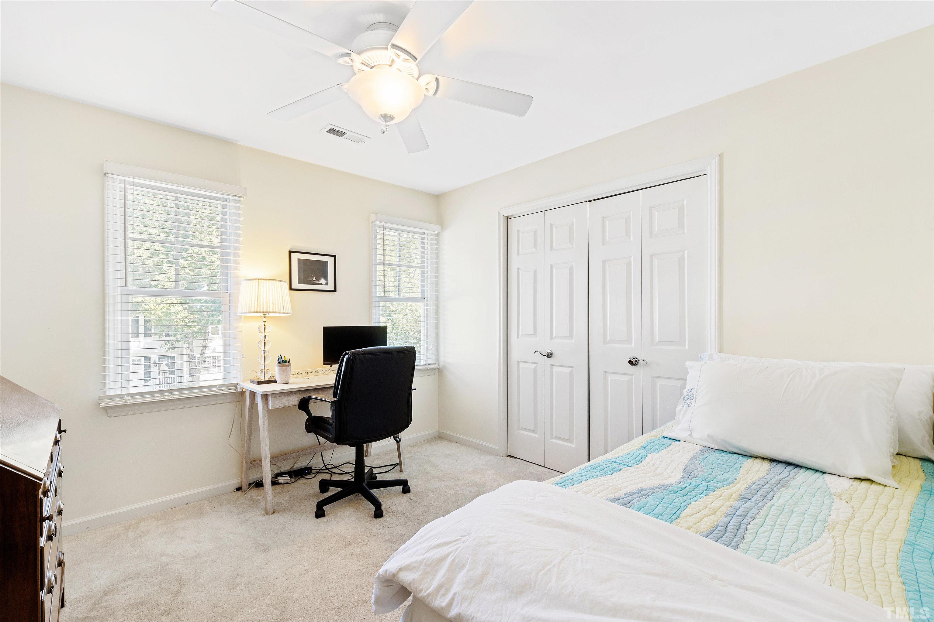 2526 Noble Road Raleigh, NC 27608 - Photo 18 of 27 a bedroom with a bed and a window