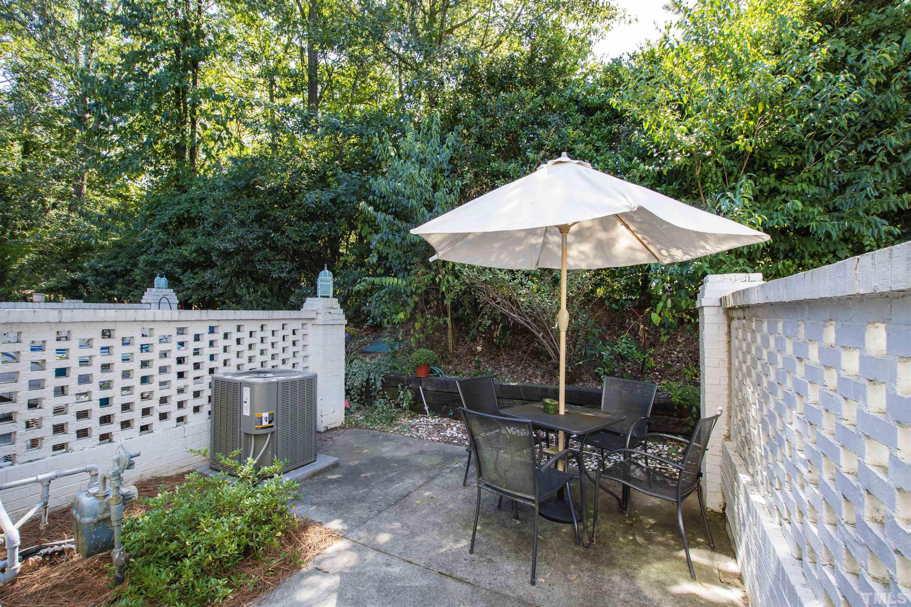 2526 Noble Road Raleigh, NC 27608 - Photo 22 of 27 a backyard of a house with table and chairs