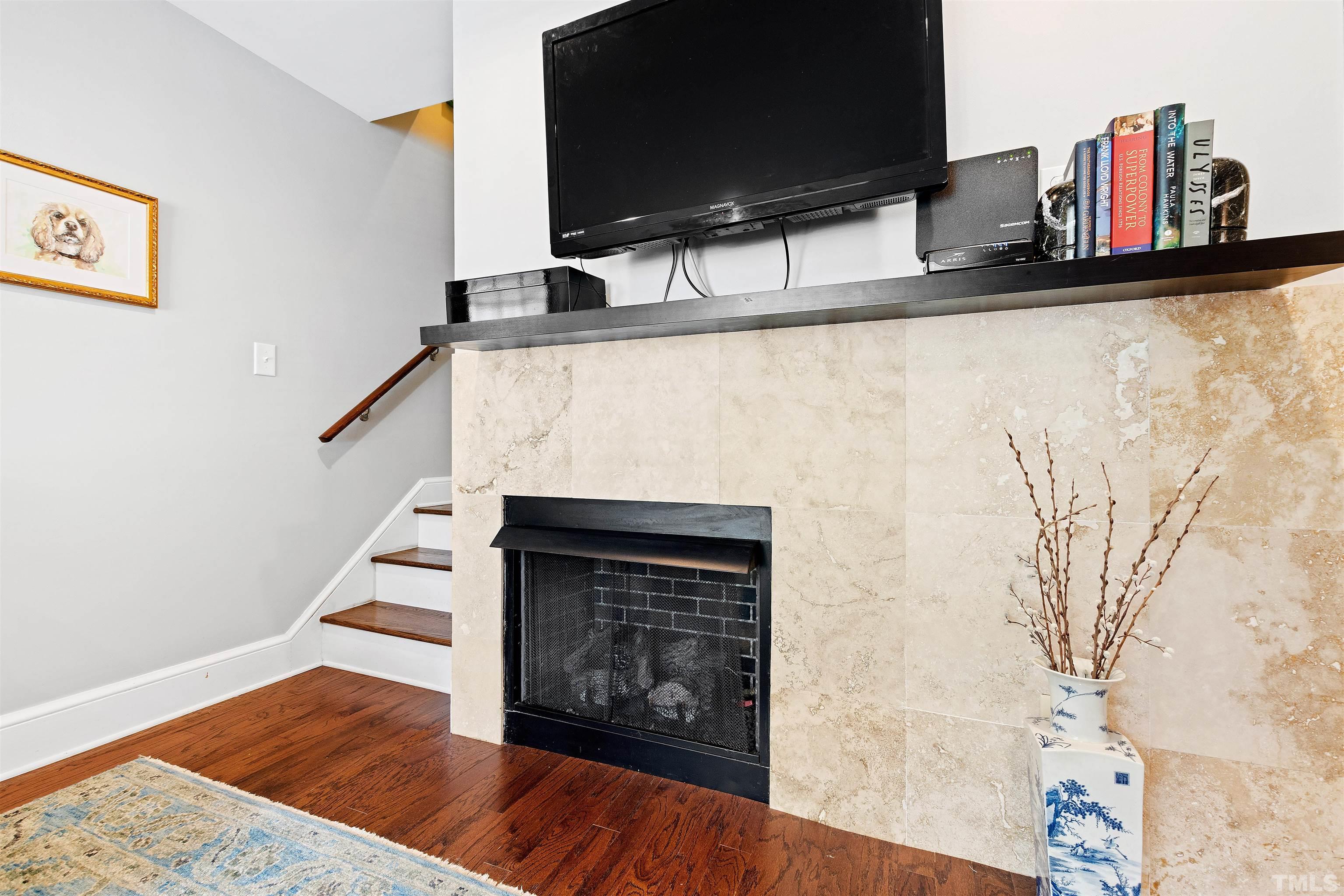 2526 Noble Road Raleigh, NC 27608 - Photo 7 of 27 a kitchen with a stove and a wooden floor