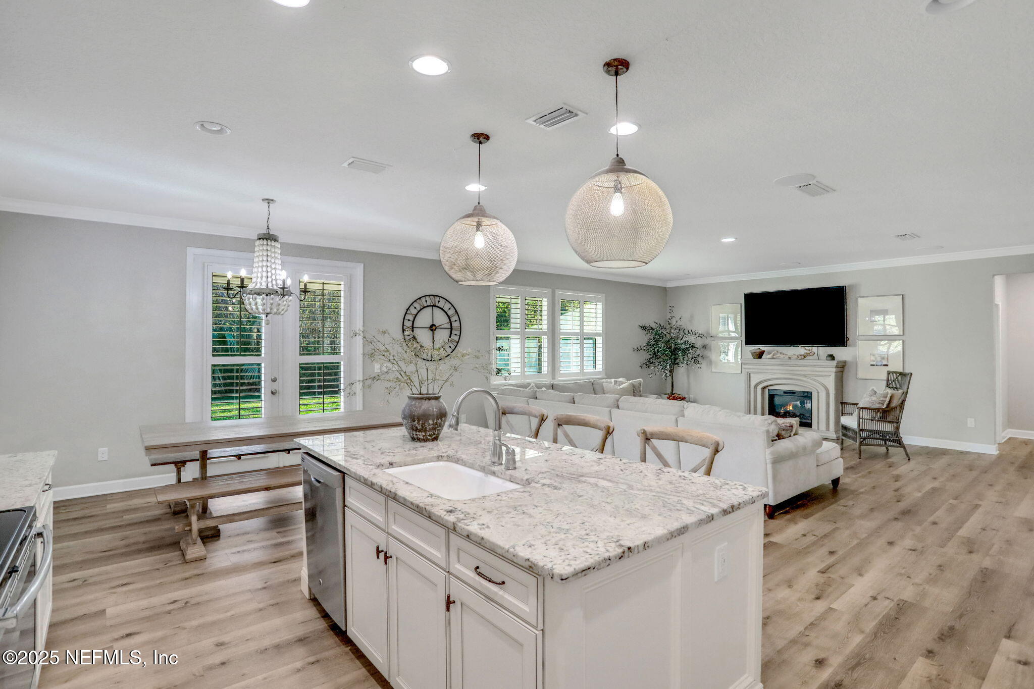 119 Duck Pond Drive St. Augustine, FL 32086 - Photo 14 of 56 a view of living room kitchen with a sink and dishwasher with wooden floor