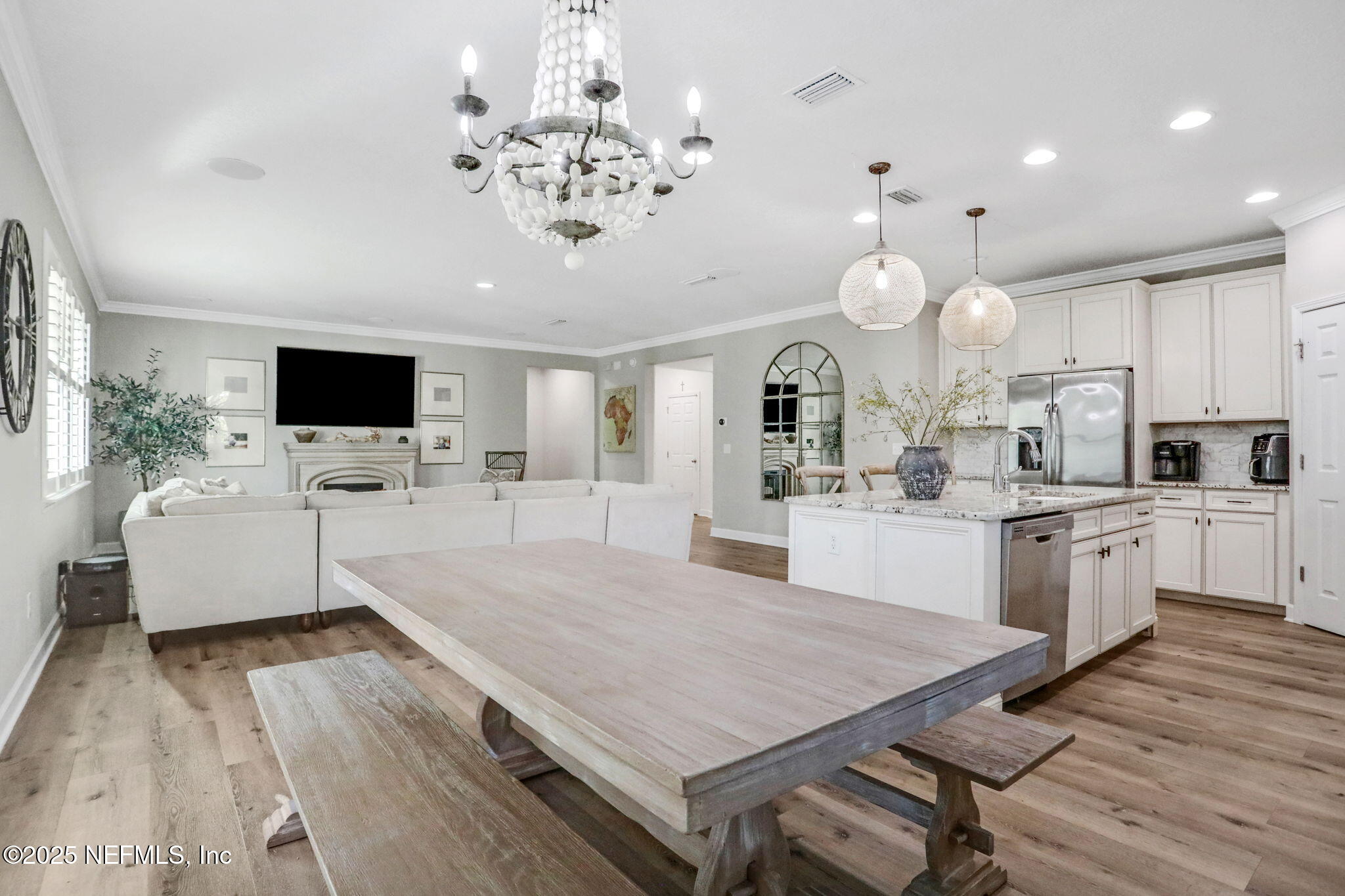 119 Duck Pond Drive St. Augustine, FL 32086 - Photo 19 of 56 a large kitchen with kitchen island a sink counter space stainless steel appliances and a chandelier