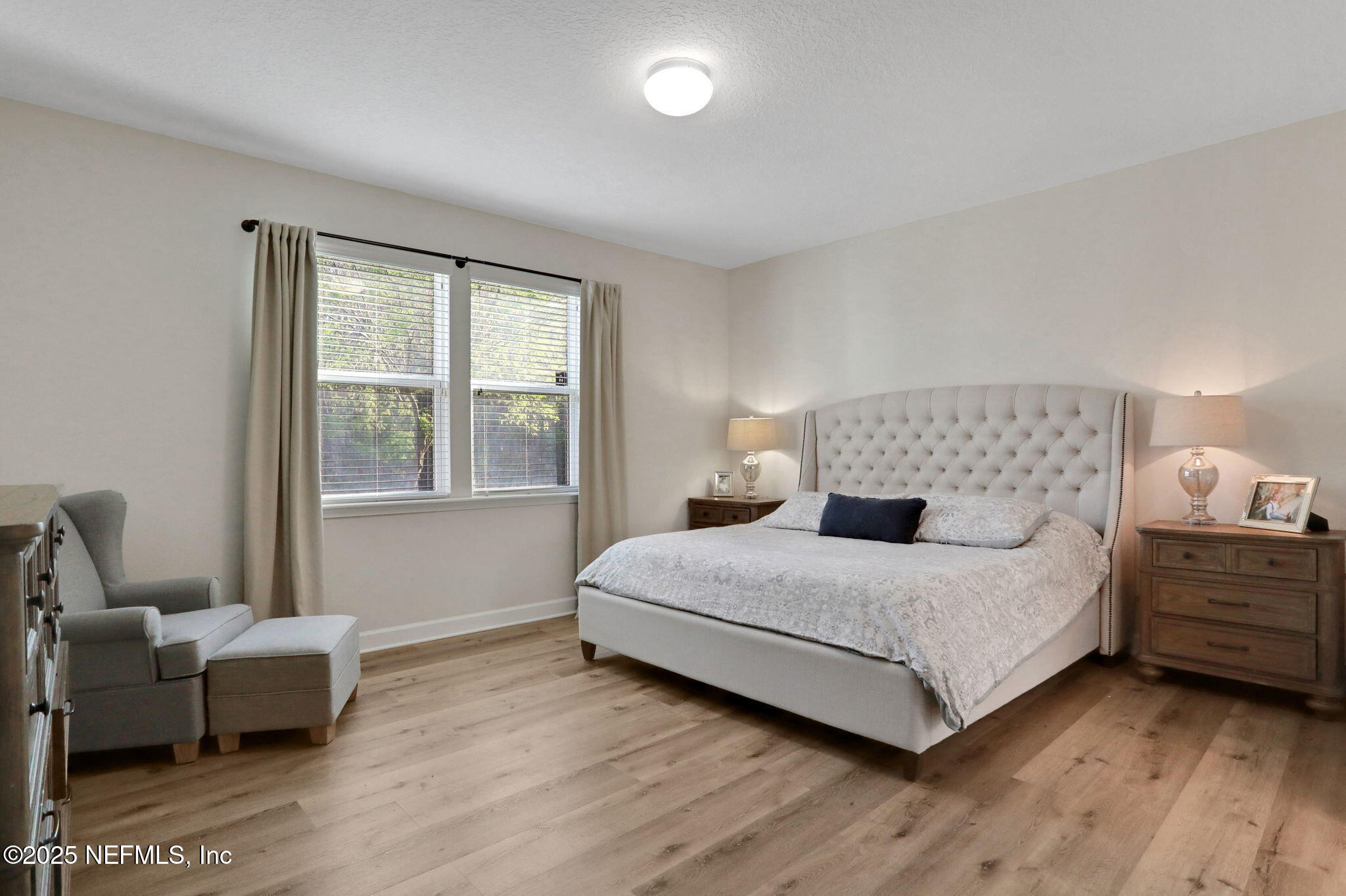 119 Duck Pond Drive St. Augustine, FL 32086 - Photo 21 of 56 a bedroom with a bed and a couch