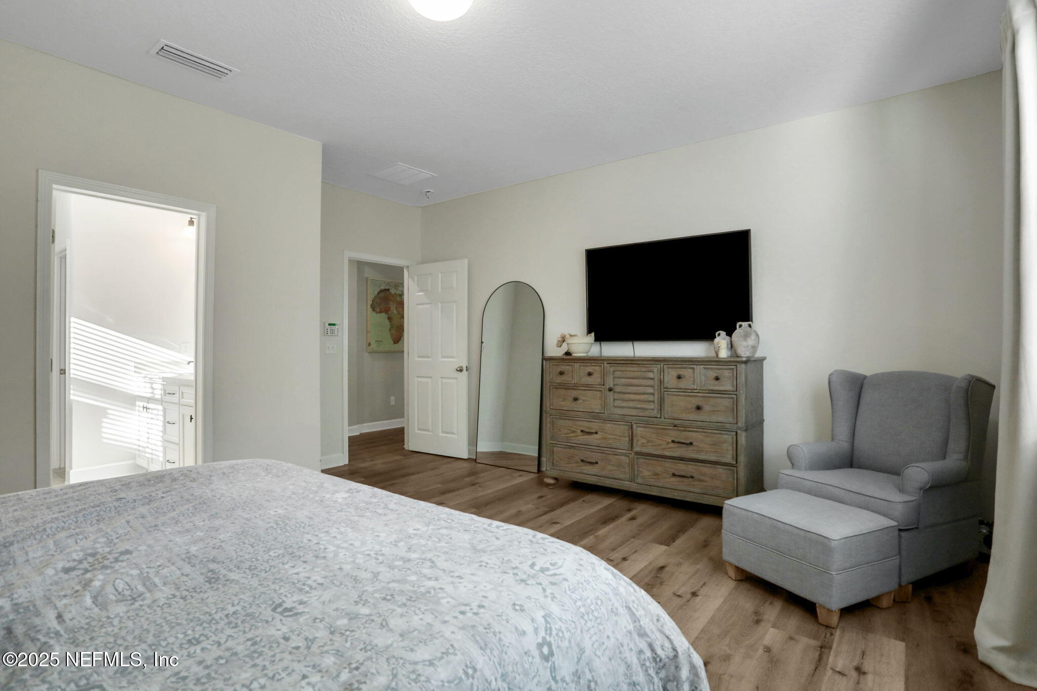 119 Duck Pond Drive St. Augustine, FL 32086 - Photo 23 of 56 a bedroom with furniture and a flat screen tv