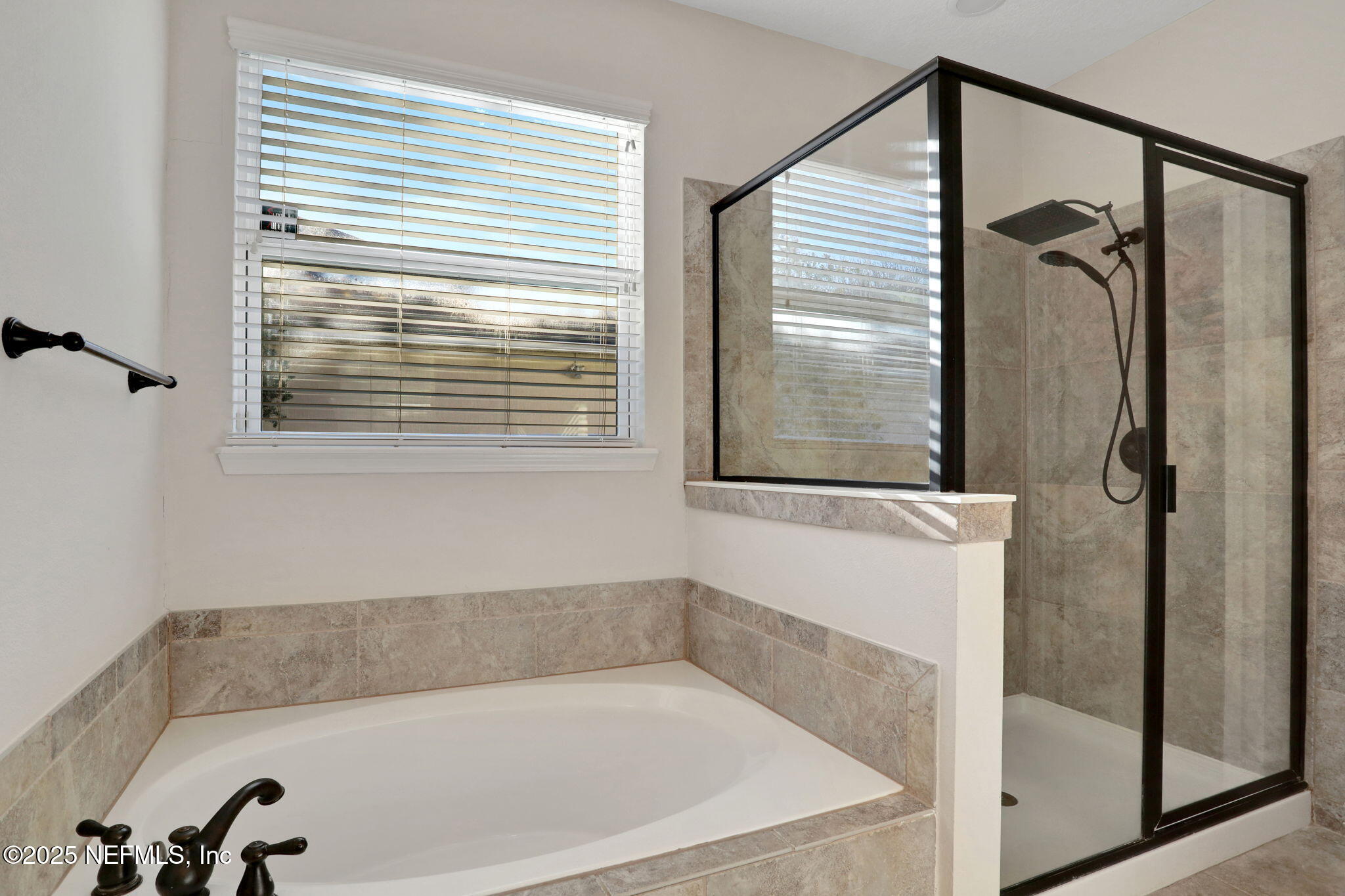 119 Duck Pond Drive St. Augustine, FL 32086 - Photo 24 of 56 a bathroom with a bathtub and shower