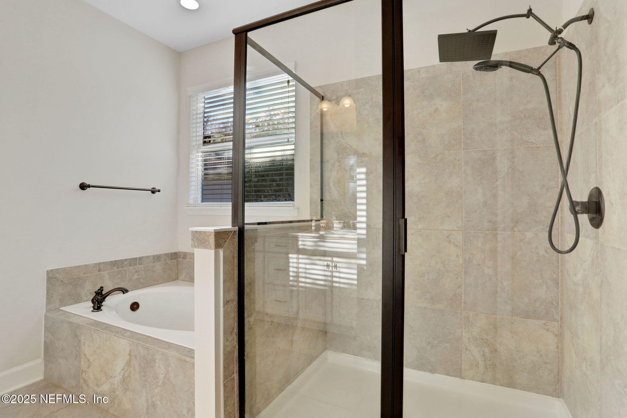 119 Duck Pond Drive St. Augustine, FL 32086 - Photo 25 of 56 a bathroom with a bathtub and shower