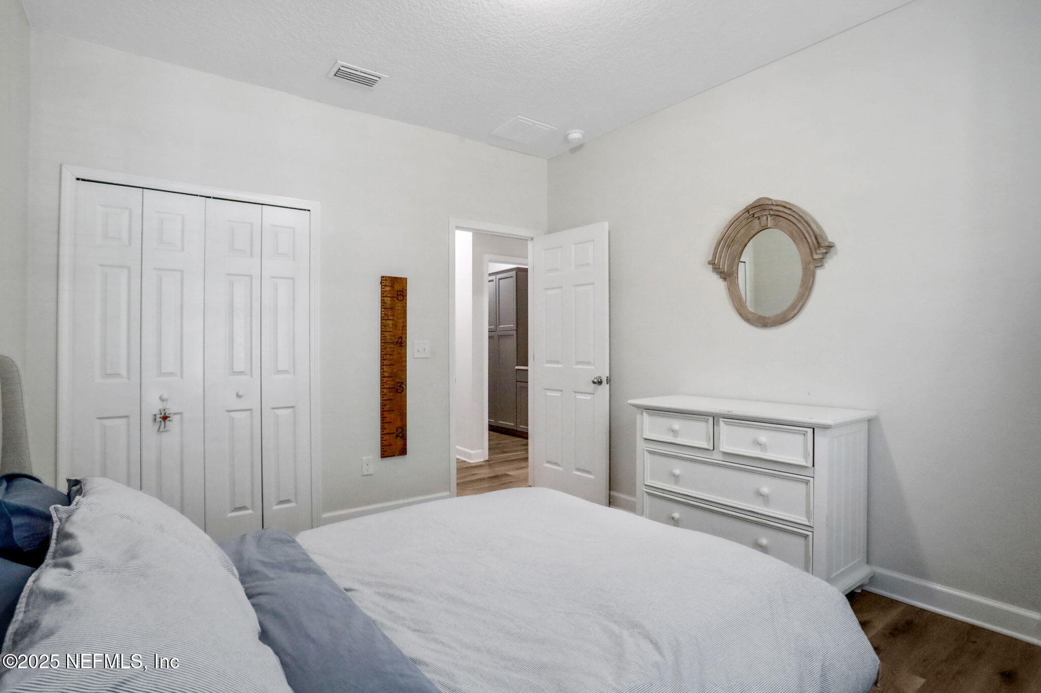 119 Duck Pond Drive St. Augustine, FL 32086 - Photo 32 of 56 a bedroom with a bed and a cabinets