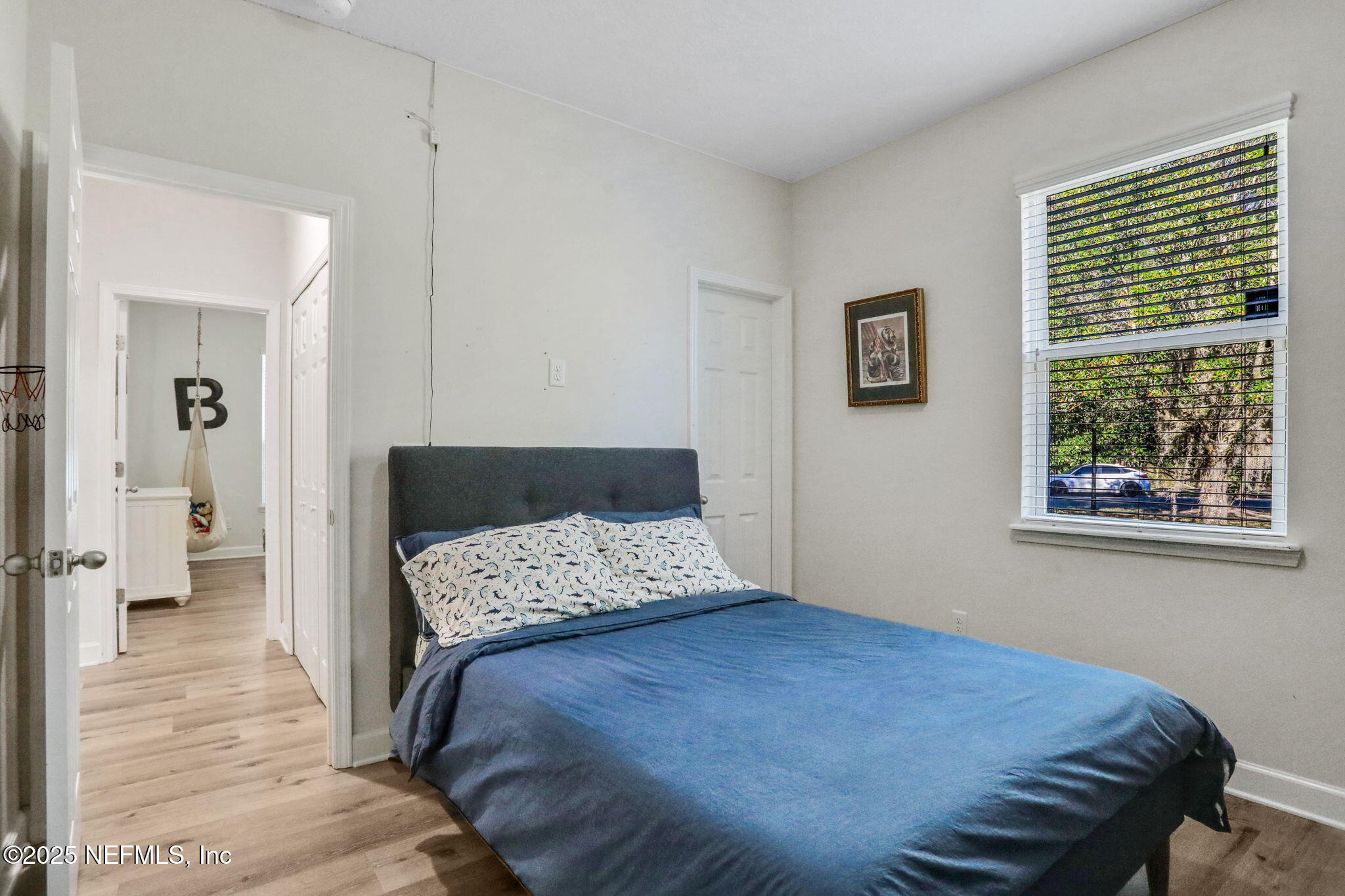 119 Duck Pond Drive St. Augustine, FL 32086 - Photo 34 of 56 a bedroom with a bed and a walk in closet