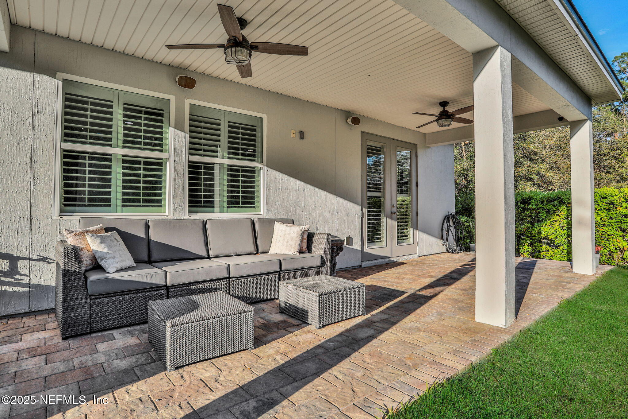 119 Duck Pond Drive St. Augustine, FL 32086 - Photo 39 of 56 a outdoor space with patio the couches and a dining table with garden view