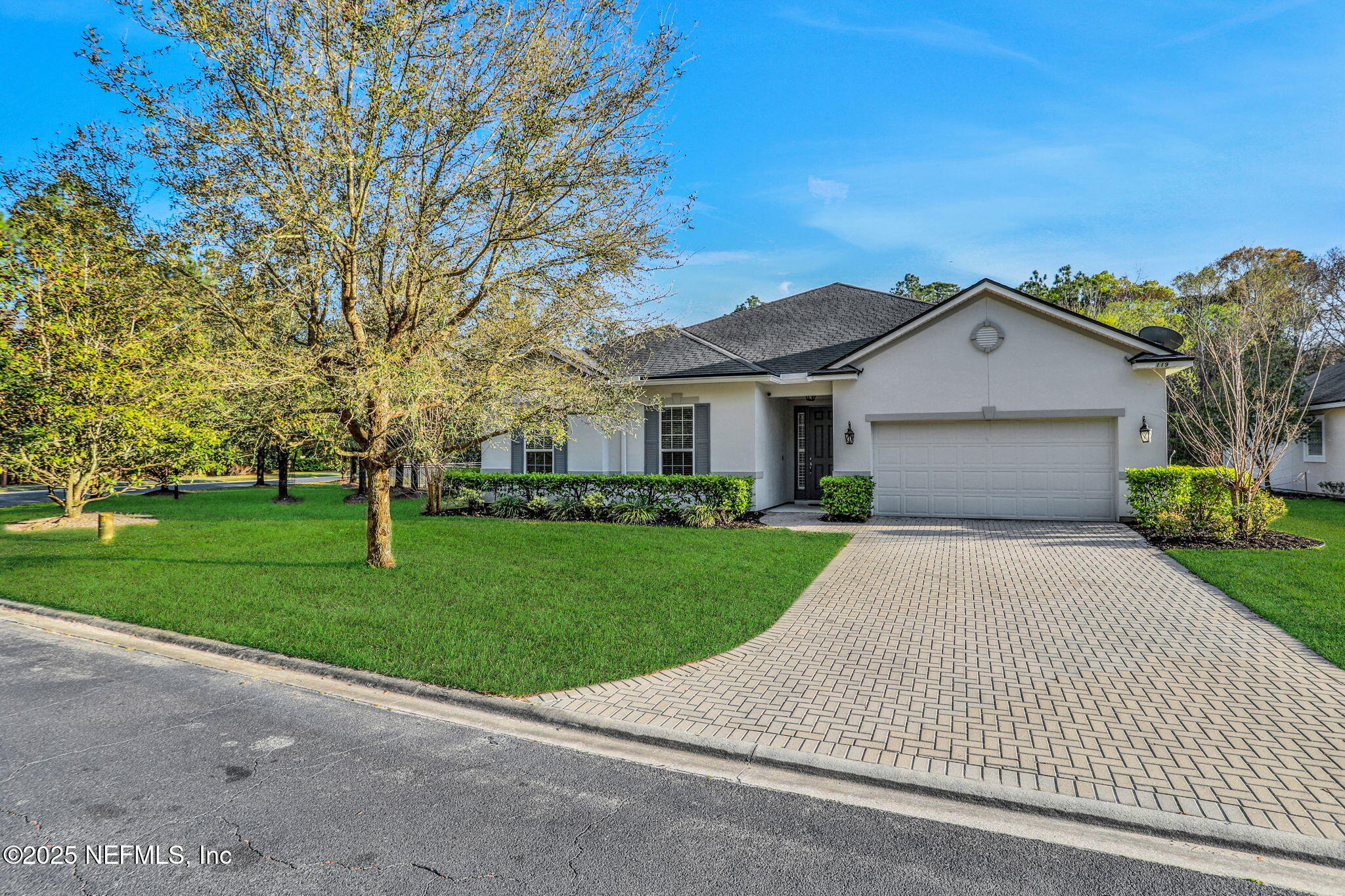 119 Duck Pond Drive St. Augustine, FL 32086 - Photo 52 of 56 a front view of a house with a yard