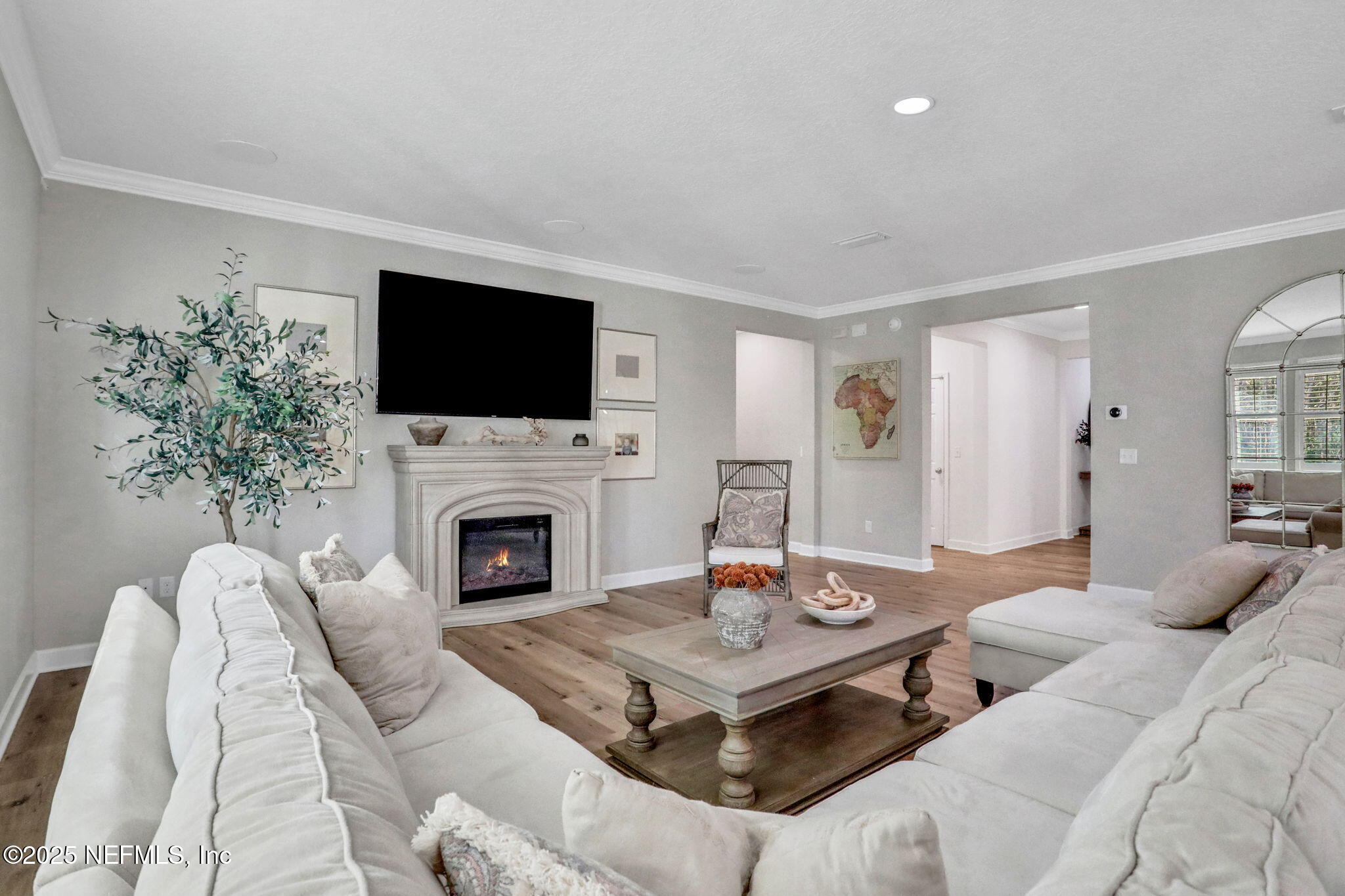 119 Duck Pond Drive St. Augustine, FL 32086 - Photo 8 of 56 a living room with furniture a fireplace and a flat screen tv