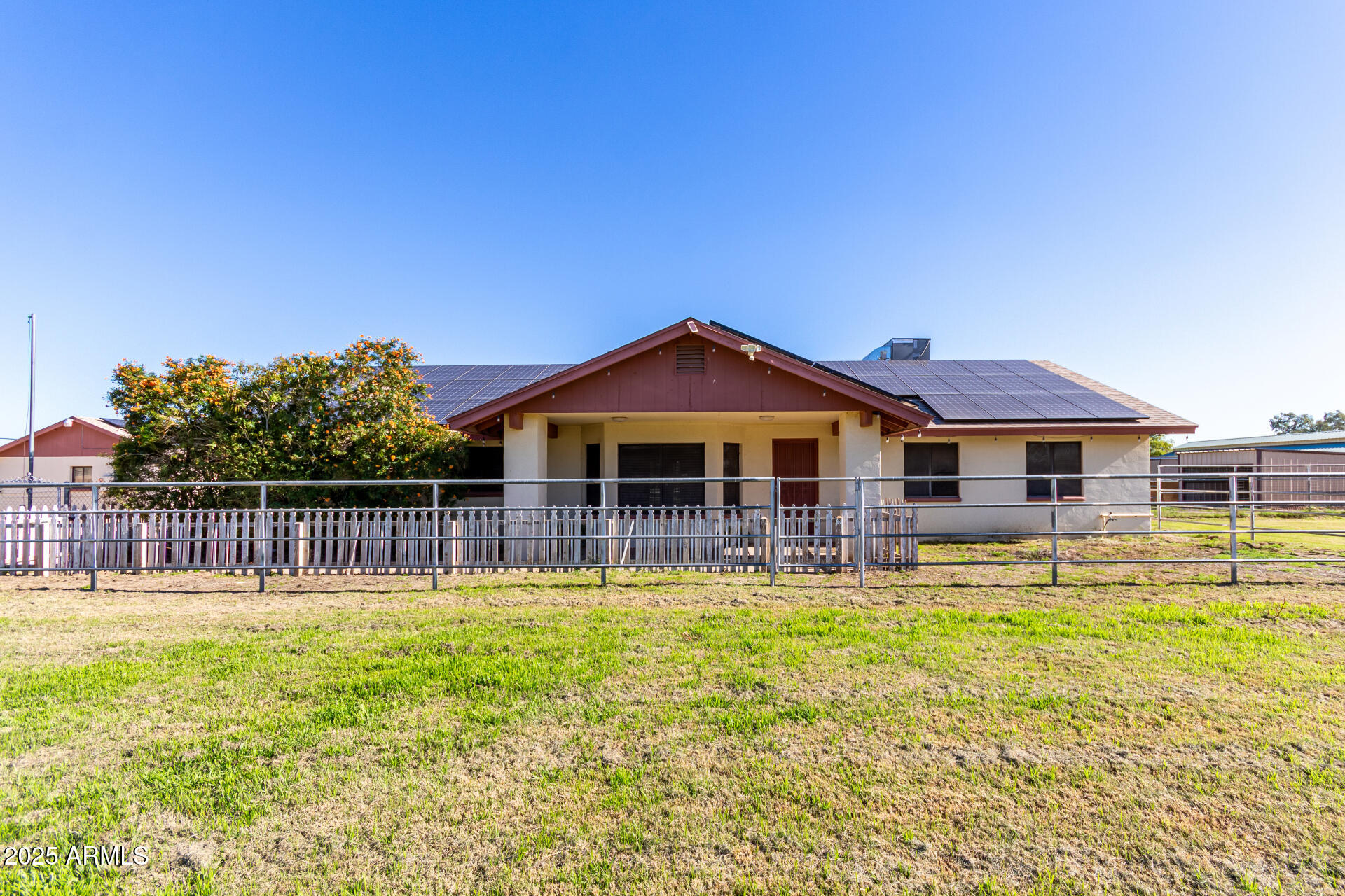 a front view of a house with swimming pool