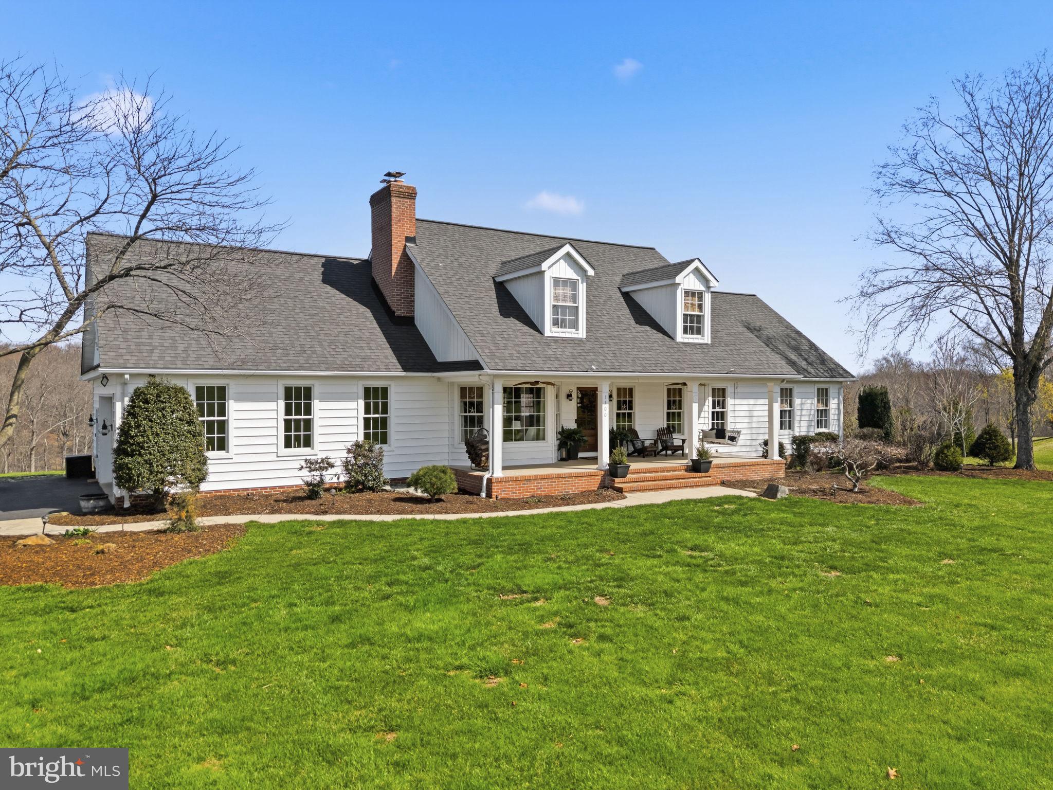 1100 Walters Mill Road Forest Hill, MD 21050 - Photo 4 of 18 a front view of a house with swimming pool and sitting area