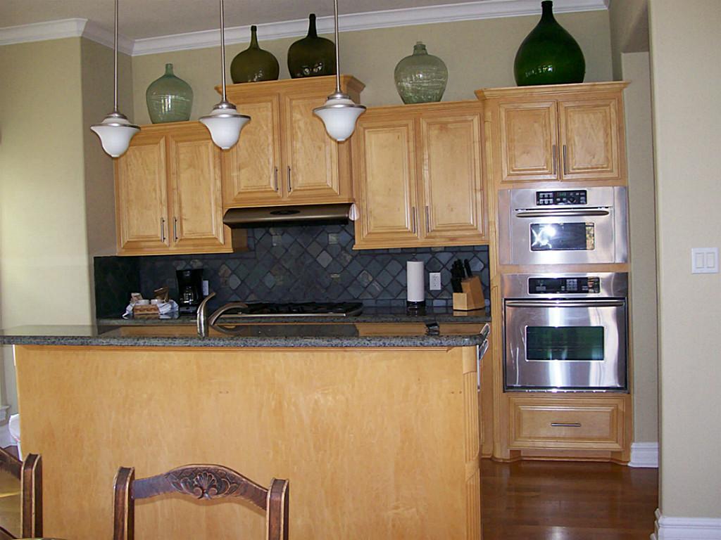 620 8th Street Kemah, TX 77565 - Photo 6 of 17 a kitchen with stainless steel appliances granite countertop a refrigerator a stove and a sink