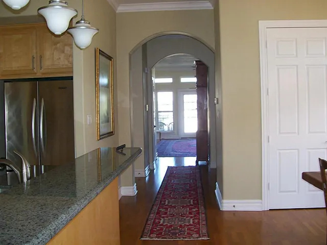 a view of a dining room with furniture and chandelier