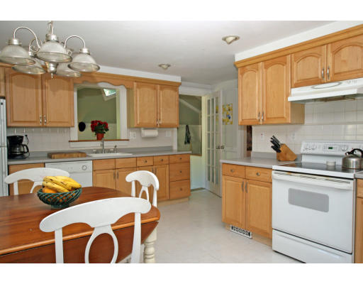 9 Pilgrim Road Hamilton, MA 01982 - Photo 12 of 26 a kitchen with a sink cabinets and window