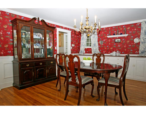 9 Pilgrim Road Hamilton, MA 01982 - Photo 15 of 26 a view of a dining room with furniture and chandelier