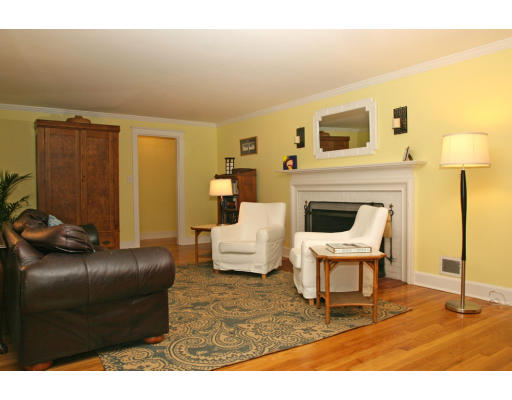9 Pilgrim Road Hamilton, MA 01982 - Photo 18 of 26 a living room with furniture and a fireplace