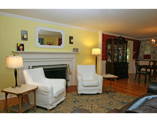 9 Pilgrim Road Hamilton, MA 01982 - Photo 19 of 26 a living room with furniture a lamp and a fireplace