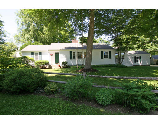 9 Pilgrim Road Hamilton, MA 01982 - Photo 2 of 26 a front view of a house with a garden