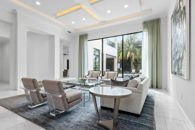 a view of a dining room with furniture wooden floor and chandelier