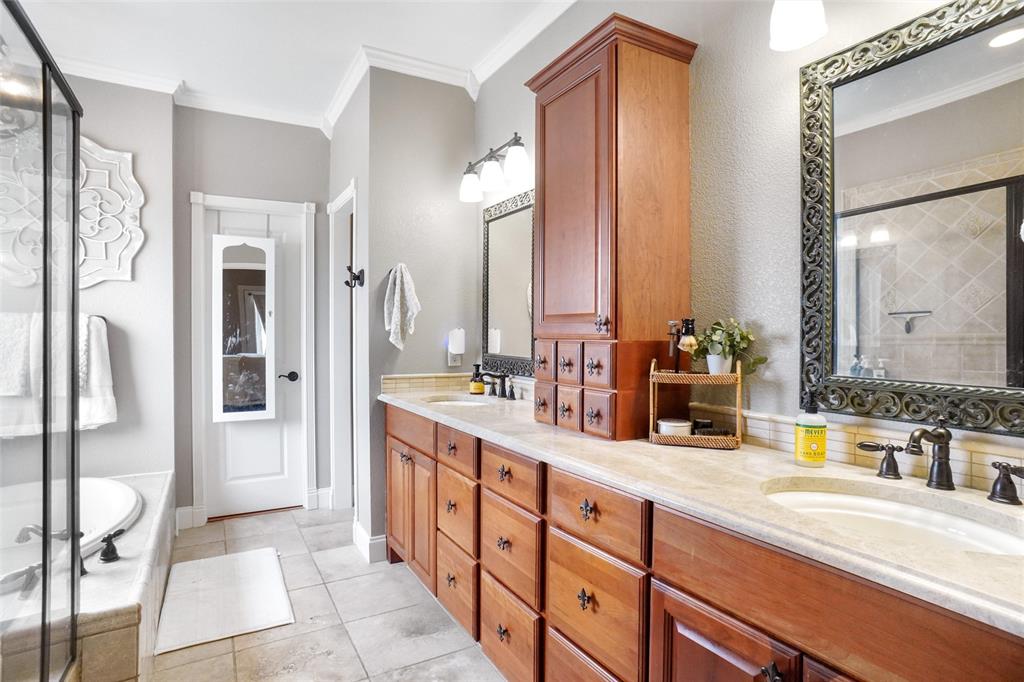 13340 John Day Road Haslet, TX 76052 - Photo 15 of 30 a spacious bathroom with a double vanity sink and a mirror