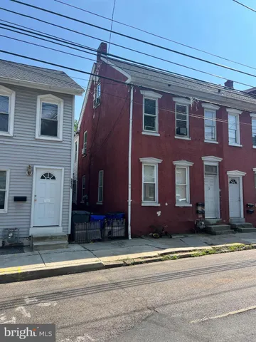 a front view of building with yard