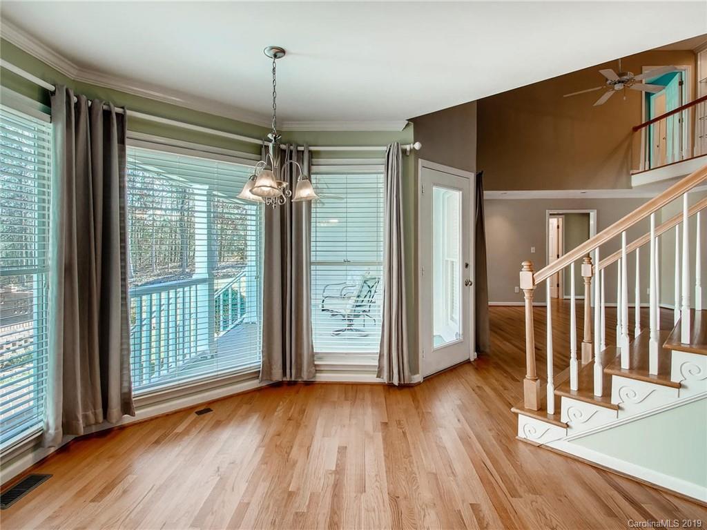 2484 Holbrook Road Fort Mill, SC 29715 - Photo 14 of 36 a view of empty room with wooden floor and fan